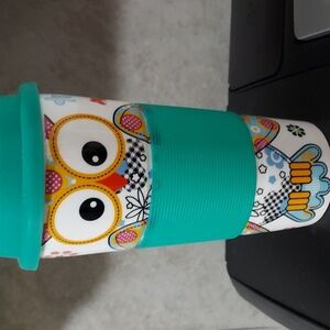 Century Owl & Flowers Travel Mug. The green and white earthenware cup